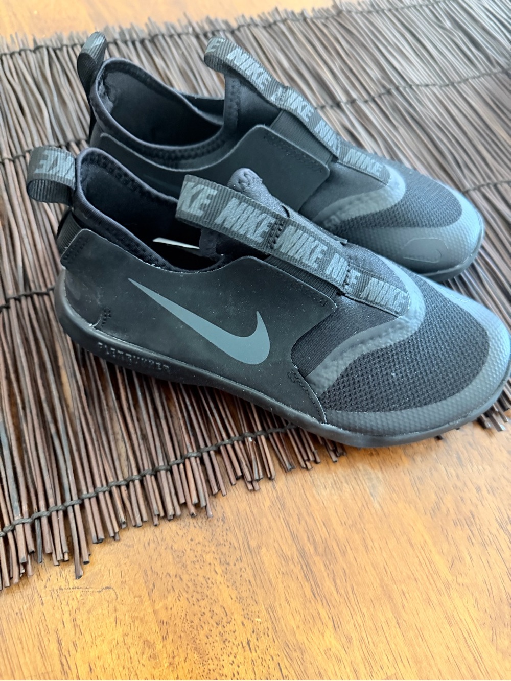 Nike Kids Black Slip-On Sneakers with Grey Swoosh